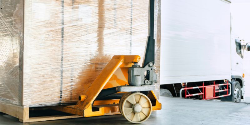 heavy-duty pallet trucks (2) A heavy-duty pallet truck is in use in a warehouse.